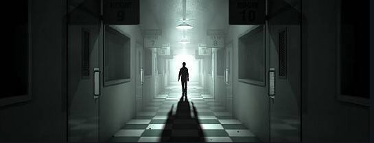 Asylum Escape room - Man walking down Corridor.